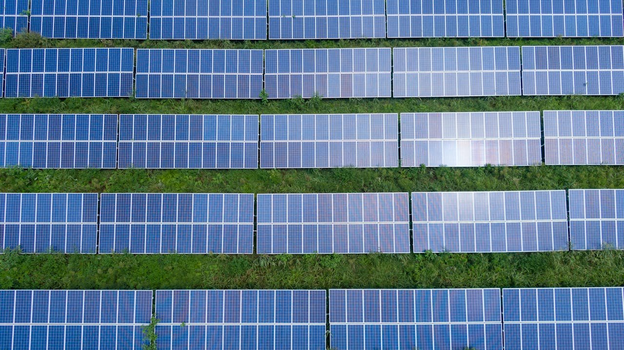 about-03 Aerial shot of a solar panel array generating renewable energy in Trenton, Georgia.